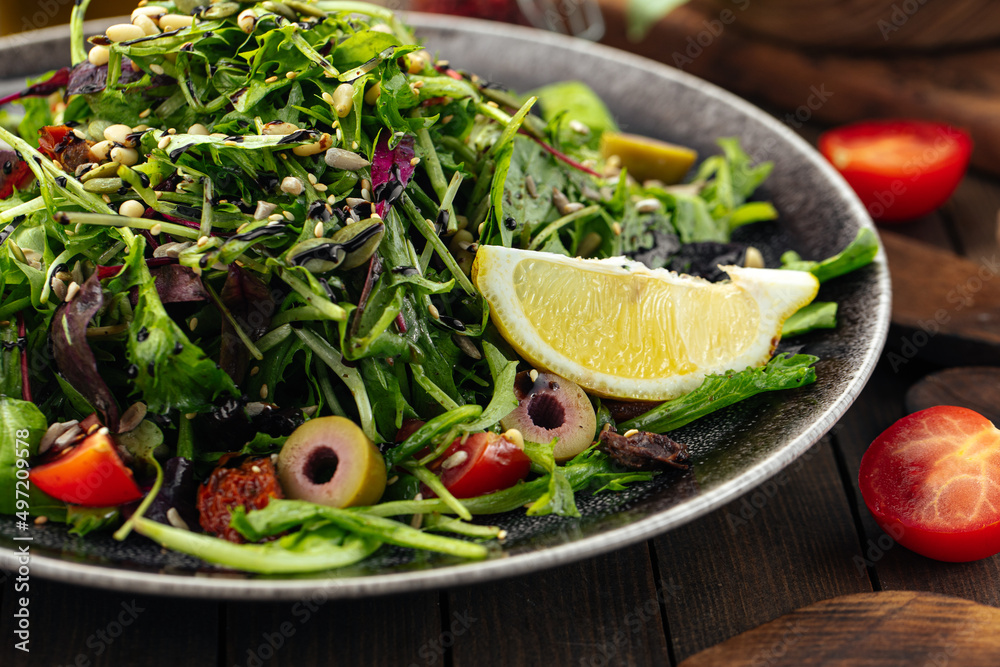 Green mediterranean salad with pine nuts and sun-dried tomatoes Green mediterranean salad with pine nuts and sun-dried tomatoes