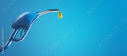 Photo Fuel pistol pump nozzle with petrol drop on wide blue background with mock up place