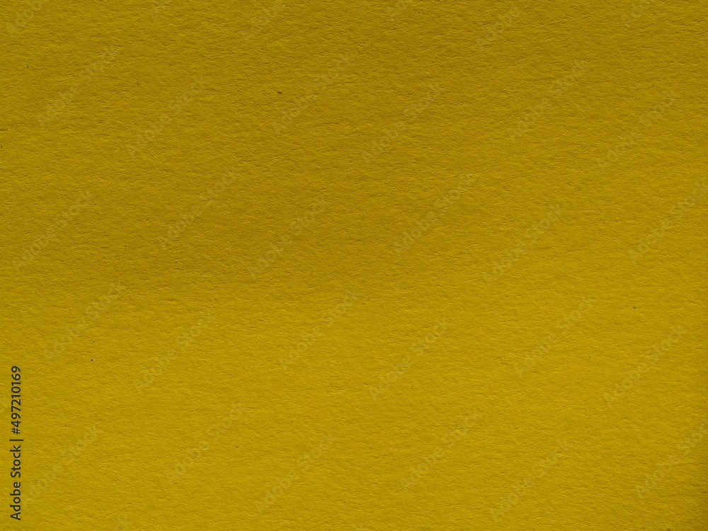 Fototapeta premium Abstract background made of green-yellow paper. Close-up, paper texture. Yellow-green cardboard close-up-textured paper background. Abstract background made of thick swamp-colored paper
