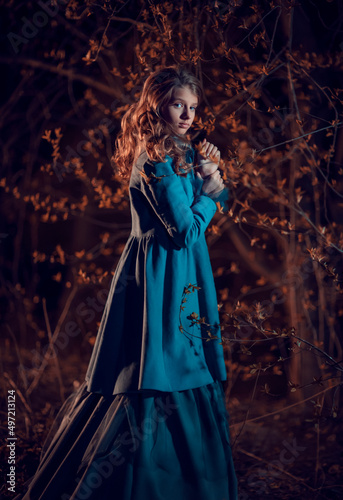 Young woman in the night spring forest