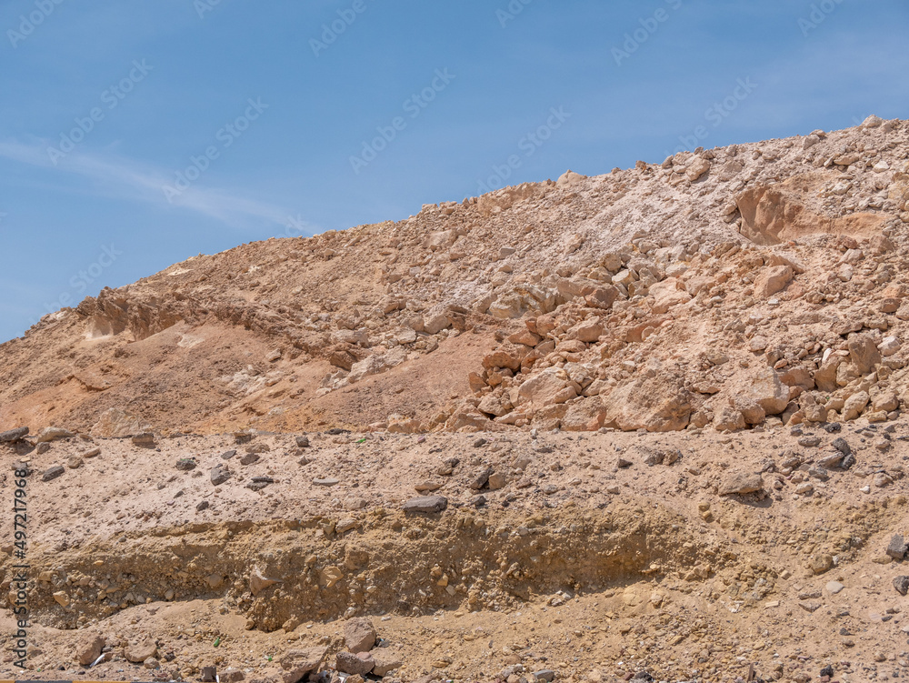 Rocky hill against the blue blue sky. Rocky landscapes mountain range. Rocky hill against the blue blue sky. Rocky landscapes mountain range.