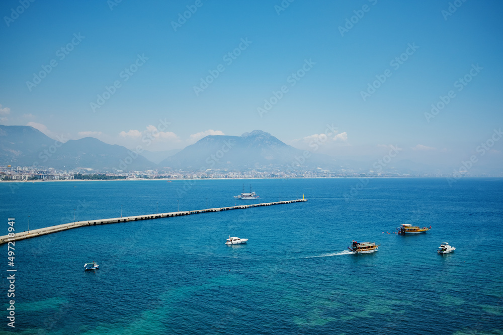 Turkey sea view on a wonderful summer vacation day for travelers. Wallpaper blue water, sky, mountains and sailing ships Turkey sea view on a wonderful summer vacation day for travelers. Wallpaper blue water, sky, mountains and sailing ships