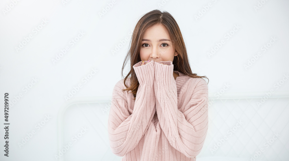 Portrait of young beautiful asian woman relax bedroom. Smile happy asian girl hands cover face wear winter cloth. Beauty treatment perfect clear skin japanese woman makeup winter hygge concept banner Portrait of young beautiful asian woman relax bedroom. Smile happy asian girl hands cover face wear winter cloth. Beauty treatment perfect clear skin japanese woman makeup winter hygge concept banner