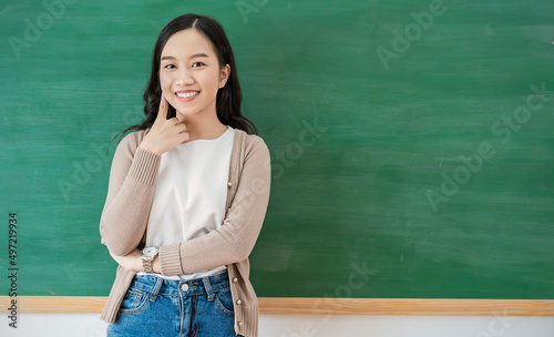 Portrait of smiling confident asian business woman in jeans suit office. Asian business girl. Startup successful power business leader executive people, teacher looking camera with copy space © paulaphoto