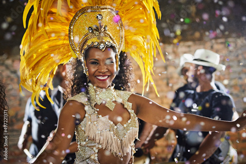 Shes the sparkling beauty of the show. Portrait of a samba dancer performing in a carnival.