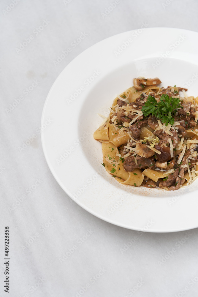 Fettuccine pasta with beef and parmesan cheese
