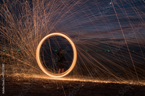 Burning Steel Wool spinning. Showers of glowing sparks from spinning steel wool