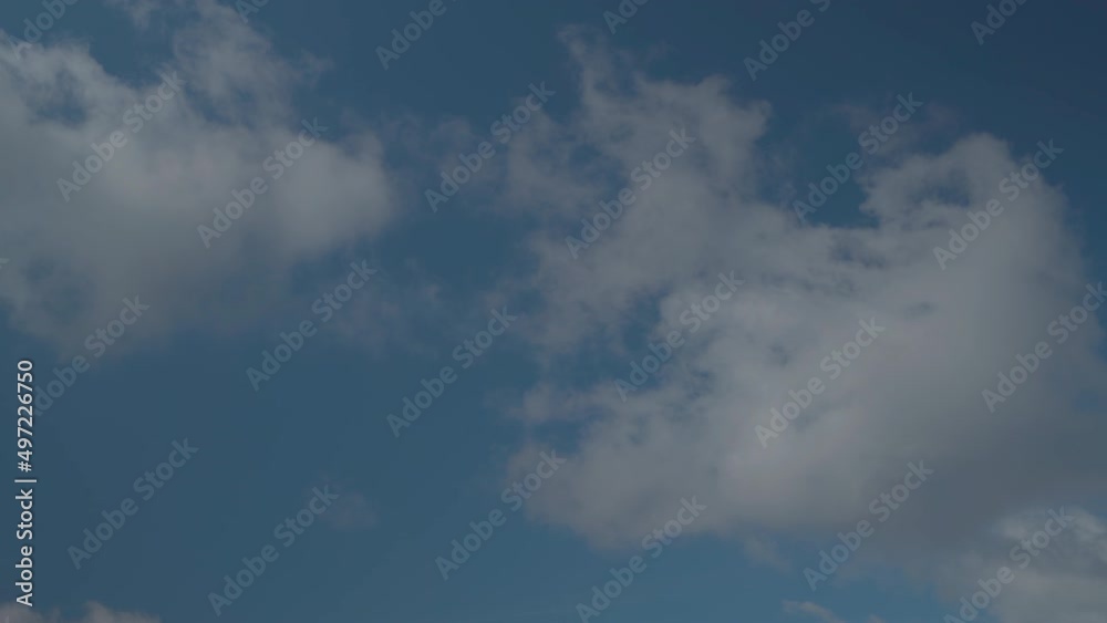 Blue sky with white clouds. White clouds float across the sky Blue sky with white clouds. White clouds float across the sky