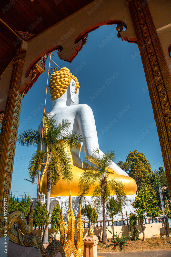 Fototapeta premium Wat Phrathat Doi Kham, Buddha pagoda and golden chedi in Chiang Mai, Thailand