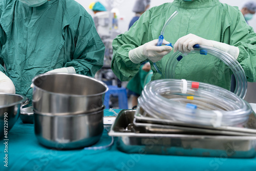 scrub nurse prepare equipments for emergency endovascular operation