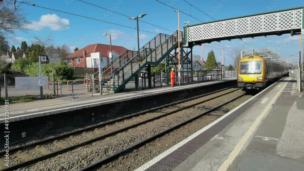electric train passing through station england uk electric train passing through station england uk