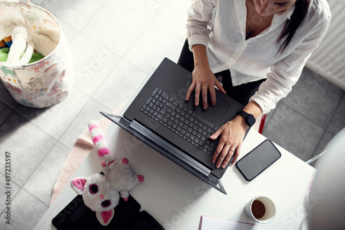 High angle view of woman using laptop photo