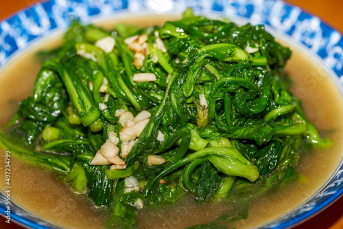 A Chinese home-cooked dish, fried lettuce with garlic