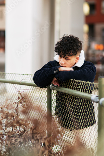 Teenage boy looking away photo
