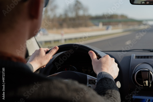 guy driving a car .Young man driving a car, interior shot