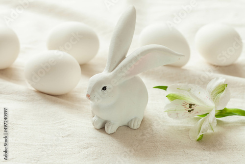 White background with easter bunny and spring flowers