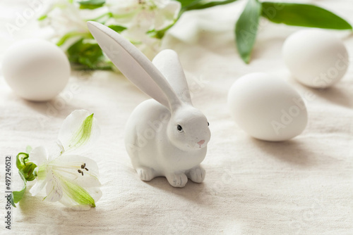 White easter background with white rabbit and white eggs, happy easter card