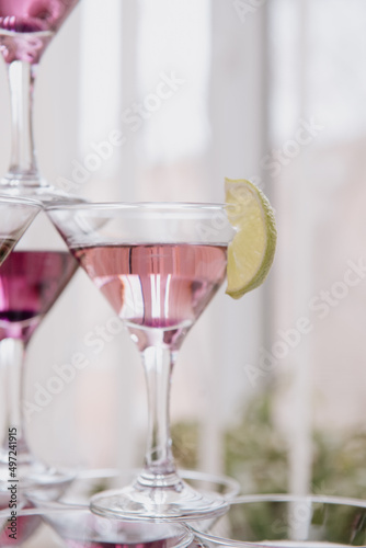 Pyramid of Champagne Glasses with Color Cocktails.