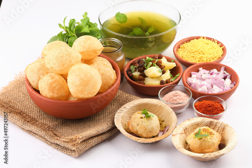 Panipuri or Golgappa is a popular street snack from India. It's a round, hollow puri filled with a mixture of flavoured water and other chat items