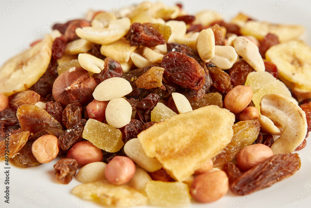 Assorted fruits and nuts. Dried healthy food. Dried grapes, peanuts, pineapple, banana, cashews, almonds.