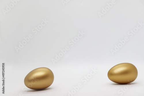 Beautiful golden easter eggs isolated on white background
