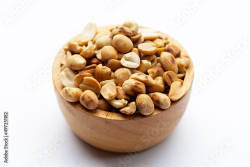 Roasted peanuts on white background.