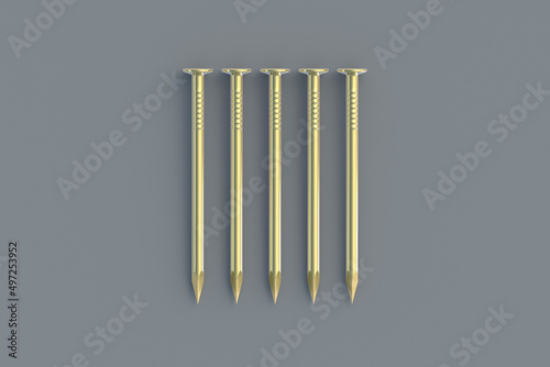 Row of golden metal nails on gray background. Building equipment. Luxury tool for repair  renovation. Expensive repairs. 3d render