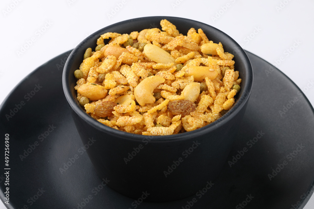 Indian Namkeen Snacks served in ceramic bowl & plate OR Indian traditional Namkeen Food Navratan Mixture or Navratna Mix Namkeen Also Know as Nimco, Namkin, Mixture or Nimko Indian Namkeen Snacks served in ceramic bowl & plate OR Indian traditional Namkeen Food Navratan Mixture or Navratna Mix Namkeen Also Know as Nimco, Namkin, Mixture or Nimko