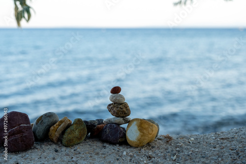 a relaxing zen concept photo of small stones put next to eachother as organised on the beach,