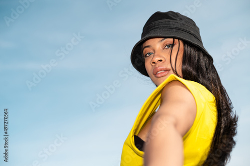 Portrait of a Pretty African American woman at the beach on a sunny day - Vacation time concept
