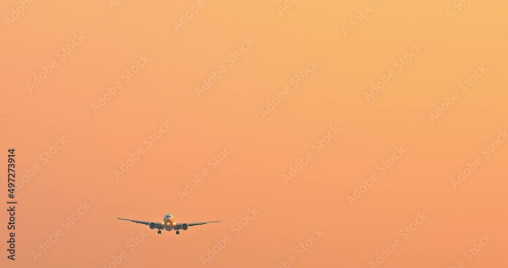 Airplane preparing to land over the airport at sunset. travel concept. 4K real time footage. Airplane preparing to land over the airport at sunset. travel concept. 4K real time footage.