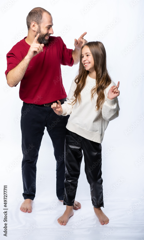 father and daughter shout, man and girl, dance, rejoice, have fun. isolated white background father and daughter shout, man and girl, dance, rejoice, have fun. isolated white background