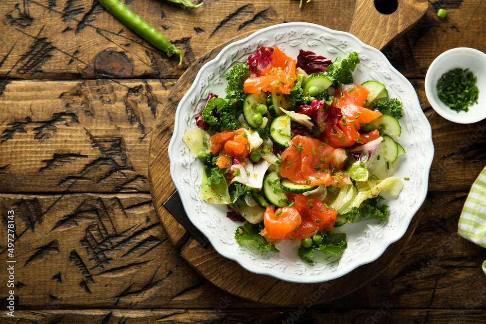 Healthy vegetable salad with smoked salmon