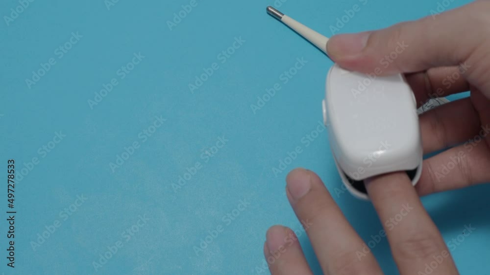 Video Stock Oximeter usage. Finger pulse oximeter used to measure pulse