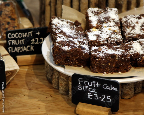 Slices of fruit cake for sale in a rustic artisan sales setting