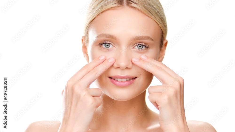 Young Caucasian light-haired woman with perfect skin touches her cheeks on white background | Beauty care concept Young Caucasian light-haired woman with perfect skin touches her cheeks on white background | Beauty care concept