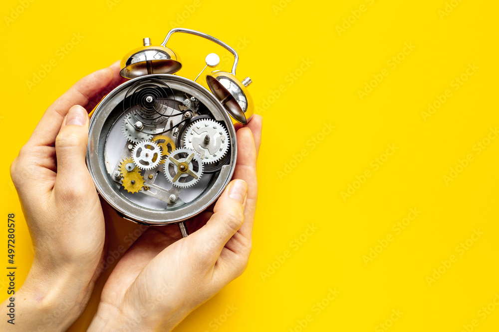 Watch mechanism with gears and wheels close up. Alarm clock mechanism