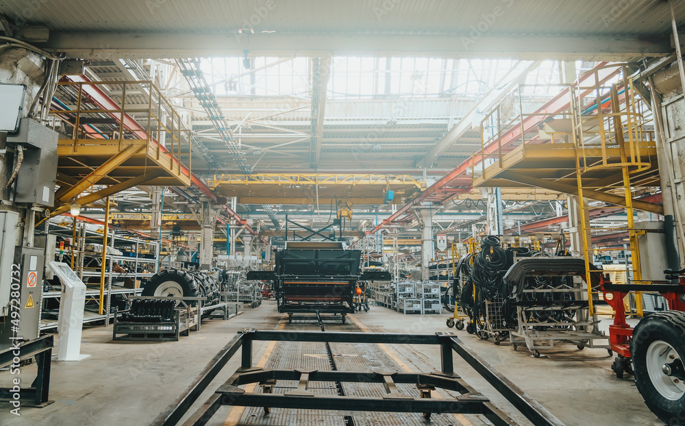 Interior of modern big industrial factory building inside. Interior of modern big industrial factory building inside.