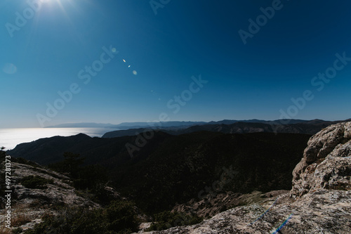 Landscape panorama with mountains in summer by the sea under a blue sky on a sunny summer day