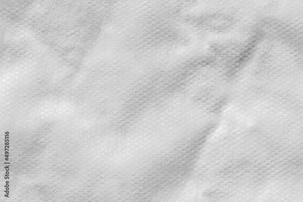 Naklejka premium Close up of a white cotton incontinence pad texture background.