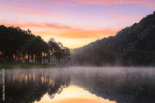 Morning in pang oung with the light and reflection steam over the lake with pine tree forest nature background, Mae Hong Son, Thailand