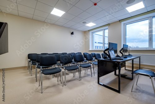  rows of seats in interior of modern empty conference hall for business meetings