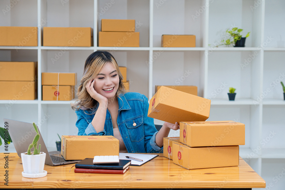 Young Business Owners Work from Home Online Business Ideas Startup Small Business SME uses laptops to receive and check orders to prepare boxes for shipping products. Sales Young Business Owners Work from Home Online Business Ideas Startup Small Business SME uses laptops to receive and check orders to prepare boxes for shipping products. Sales