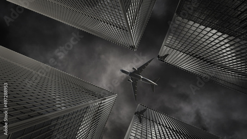 The plane flew over the tall building on a cloudy day.Modern office buildings with many corporate offices