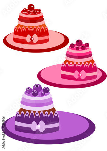 set of cakes with berries and bow © Milana
