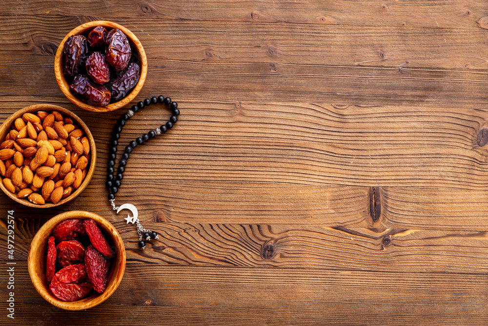 Ramadan Kareem background. Dates fruits and rosary with star and crescent Ramadan Kareem background. Dates fruits and rosary with star and crescent
