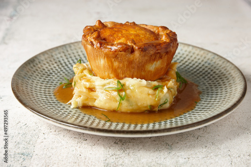 close up of a gourmet pie and mash.