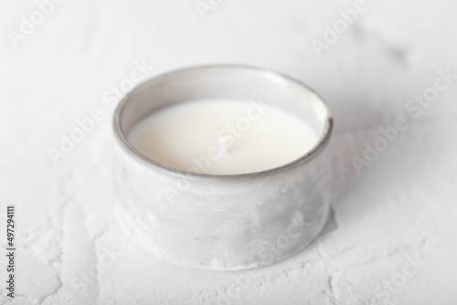 Candle with natural soy wax. A candle in a plaster mold. Interior candle. Creating comfort. photo