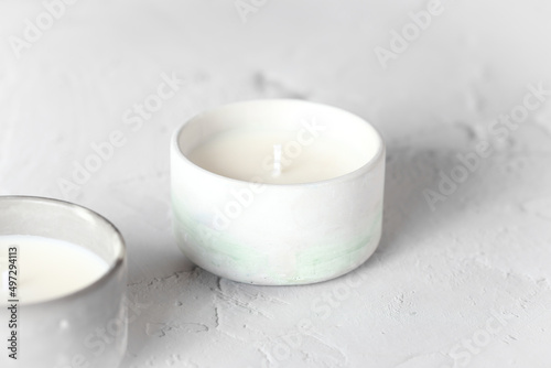Candle with natural soy wax. A candle in a plaster mold. Interior candle. Creating comfort.