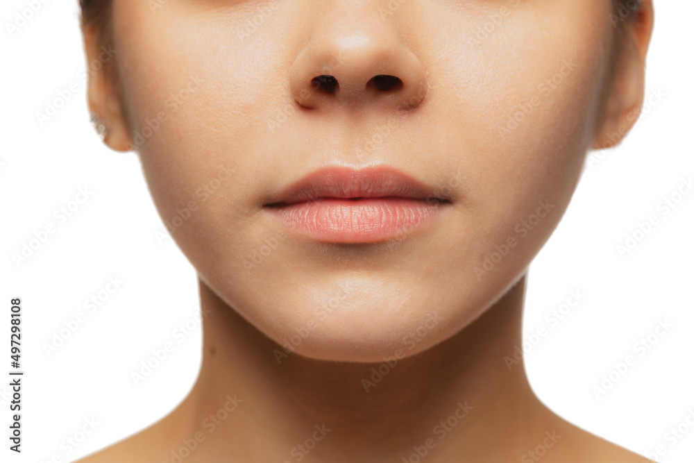 Cropped close-up image of female lips, cheecks and nose isolated over white studio bacground Cropped close-up image of female lips, cheecks and nose isolated over white studio bacground